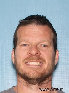 Sand From Arrest Mugshot