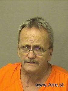 Mark Comuzie Arrest